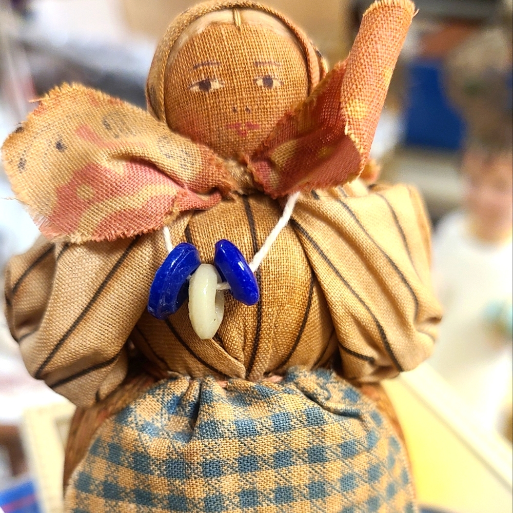 Antique 4” Doll made in Soviet Union wearing a scarf covering her blonde  braide